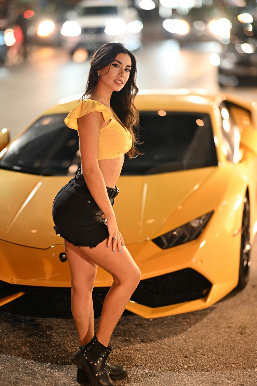 Portrait with a gold sports car